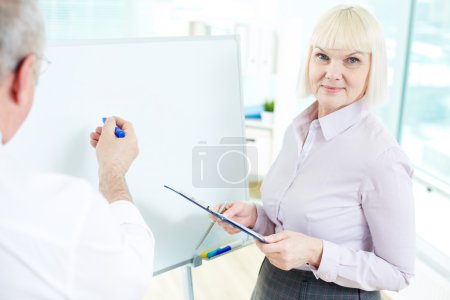 Businesswoman with  partner making presentation